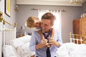 Necktie Prints: Son Hugging Father As He Gets Dressed For Work