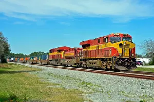 Jacksonville Prints: A south bound Florida East Coast Railroad intermodal freight train is seen passing the Saint Augustine Airport as it