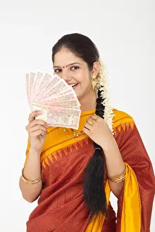 Braids Prints: South Indian woman showing banknotes