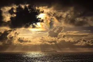 Lighthouse Prints: South Solitary Islands at sunrise with clouds and sunbeams