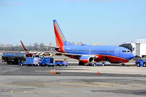 Jetliner Prints: A Southwest airline 737 parks at the passenger gate at the LaGuardia Airport
