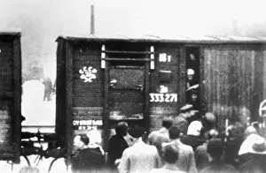 Soviet deportees boarding a train for their destinations in the Gulags of Siberia. The photo was taken in 1940 but no location is given