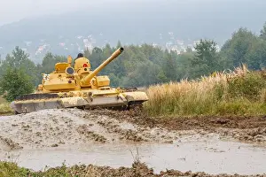 Armored Prints: Soviet T-62 main battle tank from the Cold War era during a military demonstration