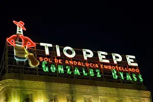 Puerto Prints: SPAIN Madrid Tio Pepe neon sign at night first billboard in Madrid advertising sherry landmark in Puerto del Sol