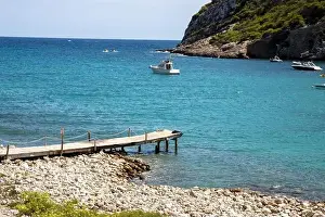Holiday Makers Prints: The Spanish island of Ibiza showing the beautiful beach front and board walk