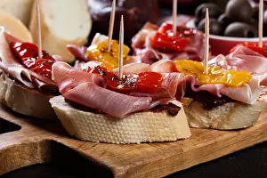 Iberian Prints: Spanish tapas with slices jamon serrano and grilled pepper