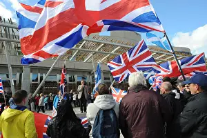 Union Jack Prints: A speaker addresses Commonwealth Unionist Party protesters demonstrating outside the Scottish Parliament
