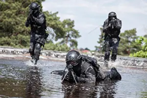 Vest Prints: Spec ops police officers SWAT in the water