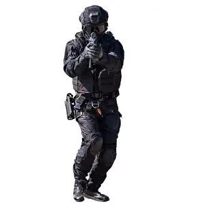 Unrecognizable Prints: Special forces member in action isolated on white background