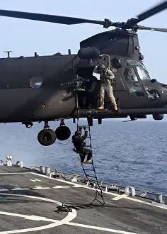 2009 Prints: Special operations forces fast-rope from an MH-47 Special Operation Aircraft assigned to the 160th Special Operations