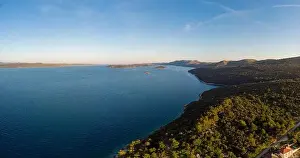 Spectacular aerial landscape with fishing village near peninsula stretching into the sea