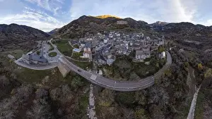 Fish Eye Prints: Spectacular drone view of small settlement located on top of rocky mountain near asphalt road in Huesca province of