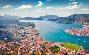 Spectacular summer cityscape of Galatas town with public stadium