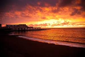 Cardigan Bay Prints: a spectacular sunset over the Pier, Cardigan Bay, Aberystwyth Wales UK