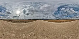 Spherical Panorama Prints: spherical 360 hdri panorama on gravel road with clouds on overcast sky in equirectangular seamless projection