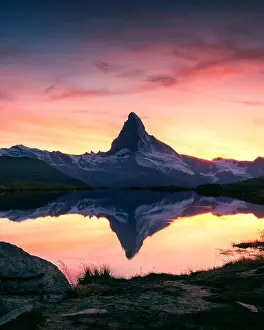 Splendid landscape with colorful sunrise on Stellisee lake with Matterhorn peak on background. Zermatt, Swiss Alps