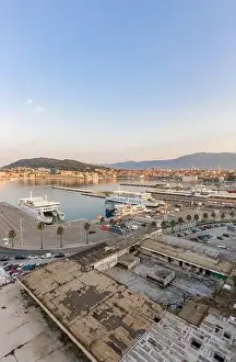 Split, Croatia - Aug 14, 2020: Aerial drone shot of ferry port at old town port in sunrise hour