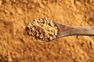 A spoonful of panela or rapadura - healthy sweetener made by evaporating sugercane juice, top view