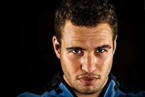 Intense Prints: Sportsman athlete head shot wet face portrait isolated on black head eyes straight ahead intense look