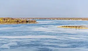 Underway Prints: a spring landscape of a boat underway off quinipet camp with distant southold in the background