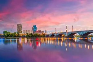 Springfield, Massachusetts, USA downtown skyline on the river at dusk