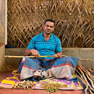 Smell Prints: Square portrait of a man making cinnamon sticks in Sri Lanka