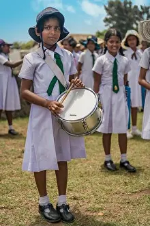 Pupils Prints: A Sri Lankan girls school band practice as they perform for the tourists at Galle Fort in Southern Sri Lanka