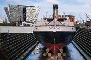 Belfast Prints: The SS Nomadic in dry dock with the Titanic Hotel and Titanic Building in the background