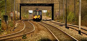 Rails Prints: St James Tyne and Wear Metro running on bending twisted golden railway lines late afternoon