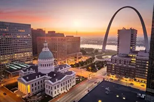 St. Louis, Missouri, USA downtown cityscape with the arch and courthouse at dusk