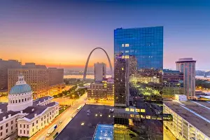 St. Louis, Missouri, USA downtown cityscape with the arch and courthouse at dusk