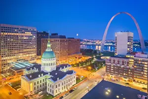 St. Louis, Missouri, USA downtown cityscape with the arch and courthouse at dusk