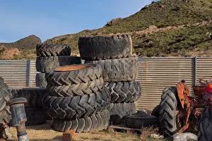 Scrap Prints: Stacked tyres from agricultural machinery and tractors in scrap yards
