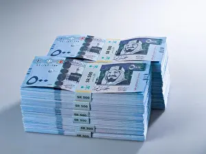 Profitability Prints: Stacks of Saudi Riyal Banknotes of 500 with image of King Abdulaziz Closeup