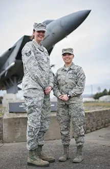 Guardsmen Prints: Staff Sgt. Taylor Ingersoll and Airman 1st Class Olivia Cappelli pose in front of an f-15 static display