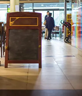 Folding Prints: Empty stand menu boards in the bar and restaurant, within the shopping center, green board