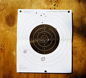 Pistol Prints: Standard 25 metre pistol shooting target which has been used