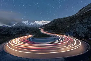 Mountain Pass Prints: Star trail and lights of car traces