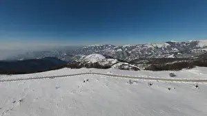 Outdoor Activities Prints: Stara Planina Babin Zub mountain in serbia covered with snow with road in winter day panorama tourist destination