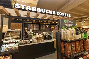 Convenience Prints: A Starbucks Coffee retail shop located inside of a large grocery store