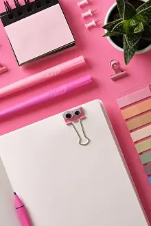 Pens Prints: Stationery background with open notepad with office supplies in pink theme
