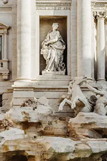 Neptune Prints: Detail statue of Abundance, Trevi Fountain (Fontana di Trevi) in Rome, Italy