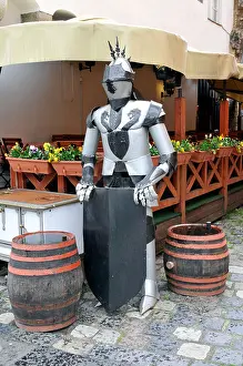 Impression Prints: Statue of antique knight near restaurant