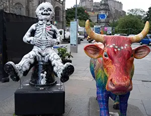 Entertaining Prints: Statue of a cow and skeleton on the street of Edinburgh during the august festival