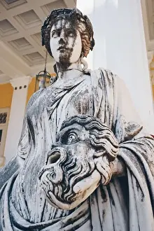 Statue of Melpomene, the muse of tragedy holding a tragic mask, on Achillion palace, Corfu Greece