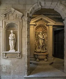 Italian Culture Prints: Statues in public palace entrance downtown Milan, Italy