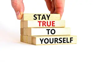 Stay Prints: Stay true to yourself symbol. Concept word Stay true to yourself on beautiful wooden block