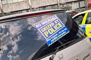 Illegal Prints: A sticker on a car in the UK, seized by the police for being uninsured
