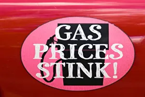 Stink Prints: A sticker that has 'GAS PRICES STINK' affixed on an automobile