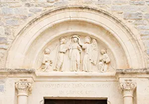 Porte Prints: Stone carving above church door Montaud, Hérault, Languedoc-Roussillon, France, Europe